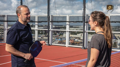 Holland America Line president Gus Antorcha with Travel Weekly senior editor Andrea Zelinski on the pickleball court onboard the Nieuw Amsterdam.