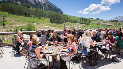 Summer guests dine on the deck of Butte 66 in Crested Butte, Colorado.